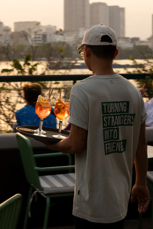 Rooftop cocktail service with Landmark 81 in view at Le Café des Stagiaires | Rooftop & Bistro